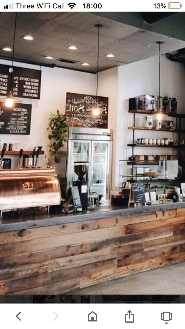 the inside of a coffee shop with lots of counter space