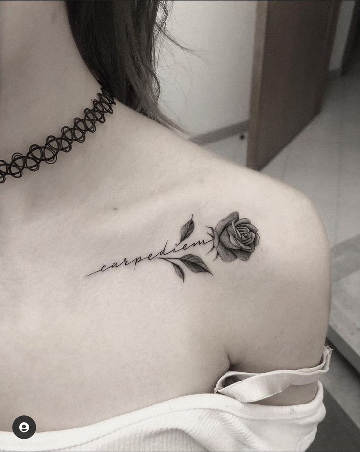 a woman with a rose tattoo on her left shoulder and the word love is written in cursive writing