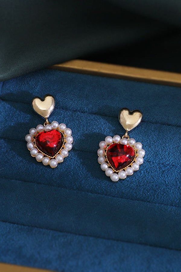 Accessorize with sweet style with these beautiful earrings! - Gold colored metal material - Heart shaped pearlescent studs with dangling faux pearl framed hearts - Length: 1.5 inches Heart Shape Earrings, Chill Room, Vintage Boho Fashion, Heart Shaped Earrings, Colorful Feathers, Sweet Style, Lace Fashion, Shoes With Jeans, Metal Material