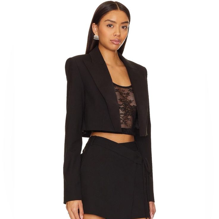 Power Up Your Business Chic Look With Nbd's Dante Cropped Blazer In Black. Featuring Padded Shoulders And Suiting Fabric, This Cropped Blazer Adds A Touch Of Sophistication. Complete The Ensemble With The Matching Trouser For A Powerful And Stylish Statement. Self: 68% Polyester 29% Viscose 3% Spandex Lining: 55% Polyester 45% Viscose Made In China Dry Clean Only Open Front Padded Shoulders Button Cuffs Midweight Suiting Fabric Model Measurement Model Is 5' 9'' And Is Wearing A Size Xs Waist 24' Sando Croptop, Business Chic, Suiting Fabric, Cropped Blazer, Black Blazer, Blazer Suit, Wide Leg Pants, Suit Jacket, Jackets For Women