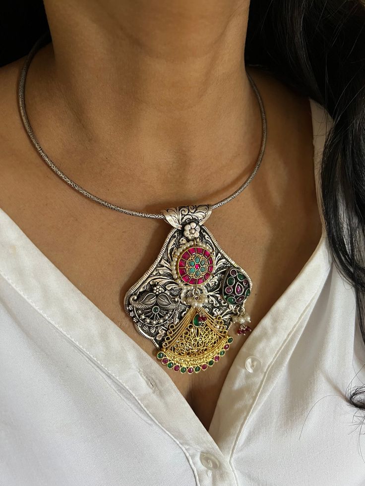 RESTOCKED ♥️ An heirloom antique pure 925 silver necklace! For all silver jewelry lovers, Shivka showcases traditional treasures with unmatched craftsmanship. The elegant Hasli necklace is Purely handmade with love by our skilled Indian craftsmen from Jaipur in real silver with antique polish and semi-precious stones. Comes with a hook closure. Metal Purity: Hallmarked 925 Silver The height of the pendant is 3 inches. The width of the pendant is 3 inches  Weight of the hasli and pendant: 77 gram Silver Dual-tone Temple Necklace As Gift, Silver Dual-tone Temple Necklace Gift, Silver Dual-tone Temple Necklace For Gift, Silver Dual-tone Kundan Necklace Temple Jewelry, Silver Dual-tone Kundan Necklace In Temple Jewelry Style, Silver Dual-tone Temple Kundan Necklace, Sterling Silver Large Pendant Jewelry For Rituals, Silver Kundan Necklace With Oxidized Finish, Sterling Silver Jewelry With Large Pendant For Rituals