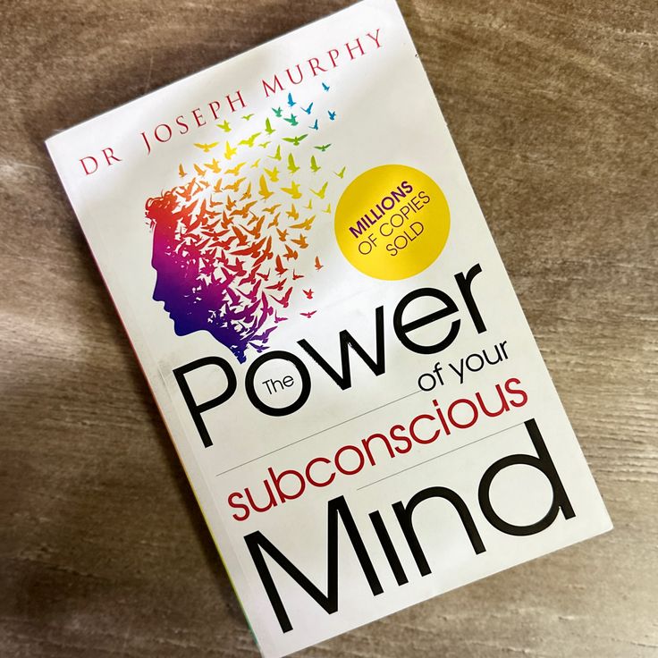 the book power of your unconscious mind by dr joseph murphy on top of a wooden table