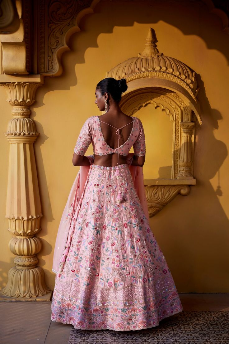 Light peach raw silk floral lehenga with delicate glass beads, sequence, thread embroidery and zardozi , paired with raw silk elbow sleeve embroidered blouse and organza dupatta with embroidered borders and sequence and resham buttis.From Chamee and Palak's The Romantics collection.DELIVERY TIMEPlease allow 8-12 weeks for your outfit to arrive.FABRIC DETAILSRaw Silk, OrganzaProfessional cleaning only. Festive Peach Anarkali Set With Intricate Embroidery, Peach Traditional Wear With Resham Embroidery For Reception, Peach Dress With Zari Work In Traditional Drape, Peach Traditional Drape Dress With Zari Work, Designer Hand Embellished Silk Lehenga, Hand Embellished Anarkali Choli In Raw Silk, Semi-stitched Hand Embellished Raw Silk Lehenga, Anarkali Style Hand Embellished Raw Silk Choli, Designer Peach Sharara With Intricate Embroidery