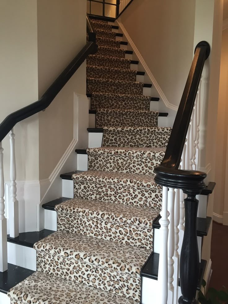 a set of stairs with leopard print carpet