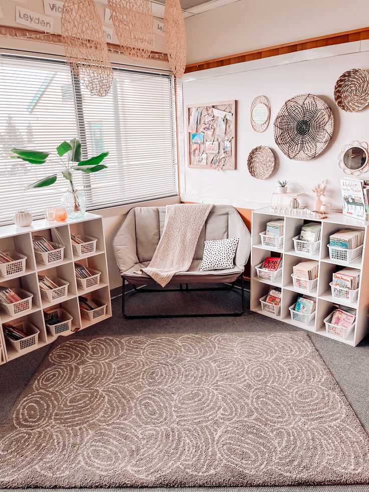 a living room filled with furniture and lots of storage space next to a large window