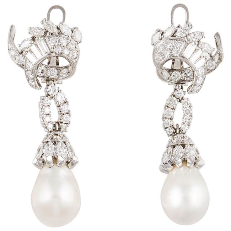 Platinum South Sea pearl and diamond drop earrings. The two South Sea pearls measure 11.5mm. There are round, marquise and baguette diamonds that total 5.50 carats; G-I color and VVS-SI clarity. Measure 1 7/8 inches long and 3/4 inches wide. They are for pierced ears with a lever back. Red Carpet Earrings, Square Diamond Earrings, South Sea Pearls Earrings, Enchanted Jewelry, Platinum Earrings, Diamond Cluster Earrings, Golden South Sea Pearls, Pearl And Diamond Earrings, Diamond Dangle Earrings