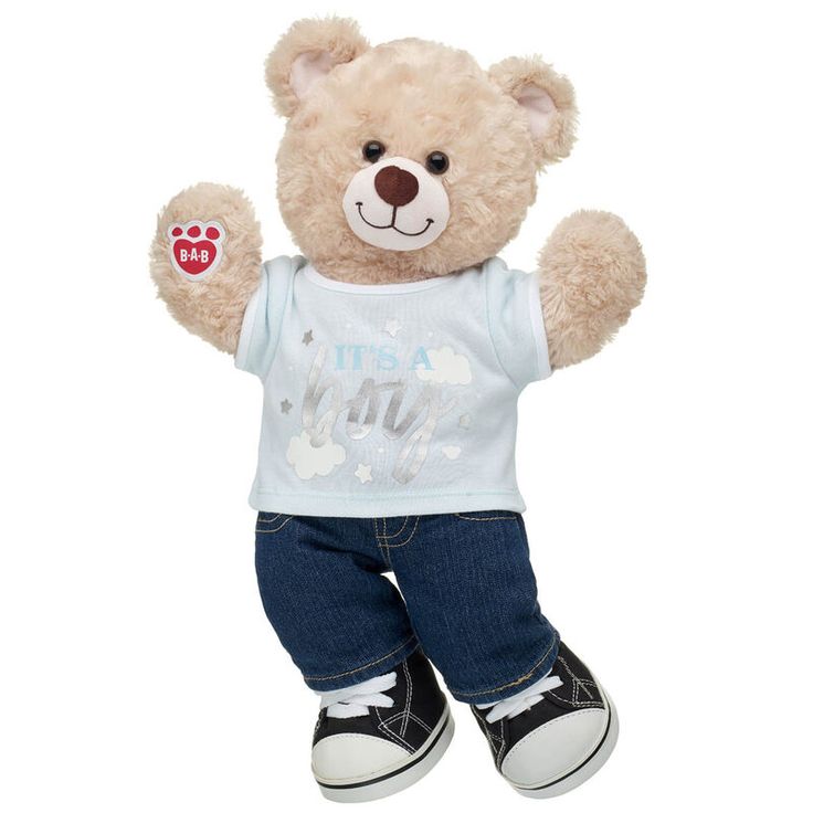 a brown teddy bear wearing jeans and a t - shirt