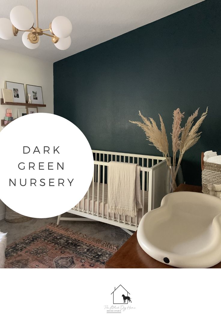 a white crib in a room with dark green walls