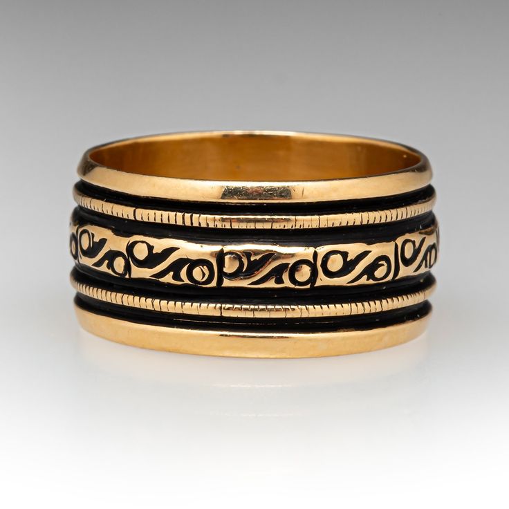 This great vintage cigar band ring features milgrain and gold scrolls that are accentuated with black antiquing. The ring is crafted in 14k yellow gold. It is currently fits like a size 6.75. We are not offering resizing due to the design of the ring. Antique Engraved Ring With Decorative Band, Victorian Gold Engraved Ring With Decorative Band, Victorian Yellow Gold Etched Rings, Victorian Etched Yellow Gold Rings, Vintage Wide Band Ring With Intricate Design, Vintage Ring With Intricate Design And Wide Band, Vintage Ring With Wide Band And Intricate Design, Antique Engraved Ring With Decorative Band For Ceremonial, Antique Engraved Ring With Decorative Band For Ceremonial Occasions