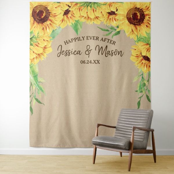 a chair sitting in front of a sunflower wedding banner