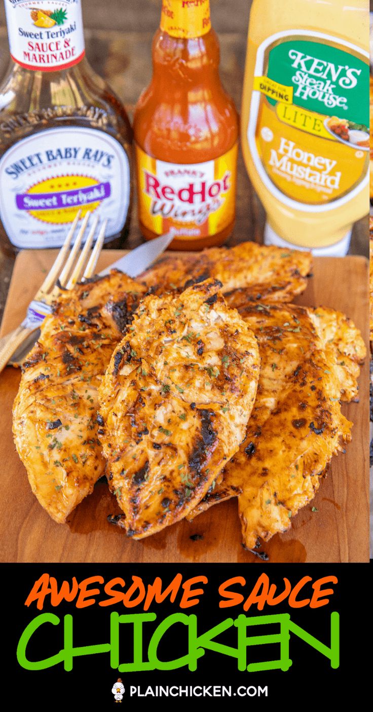 grilled chicken on a cutting board with sauces and seasonings in the background