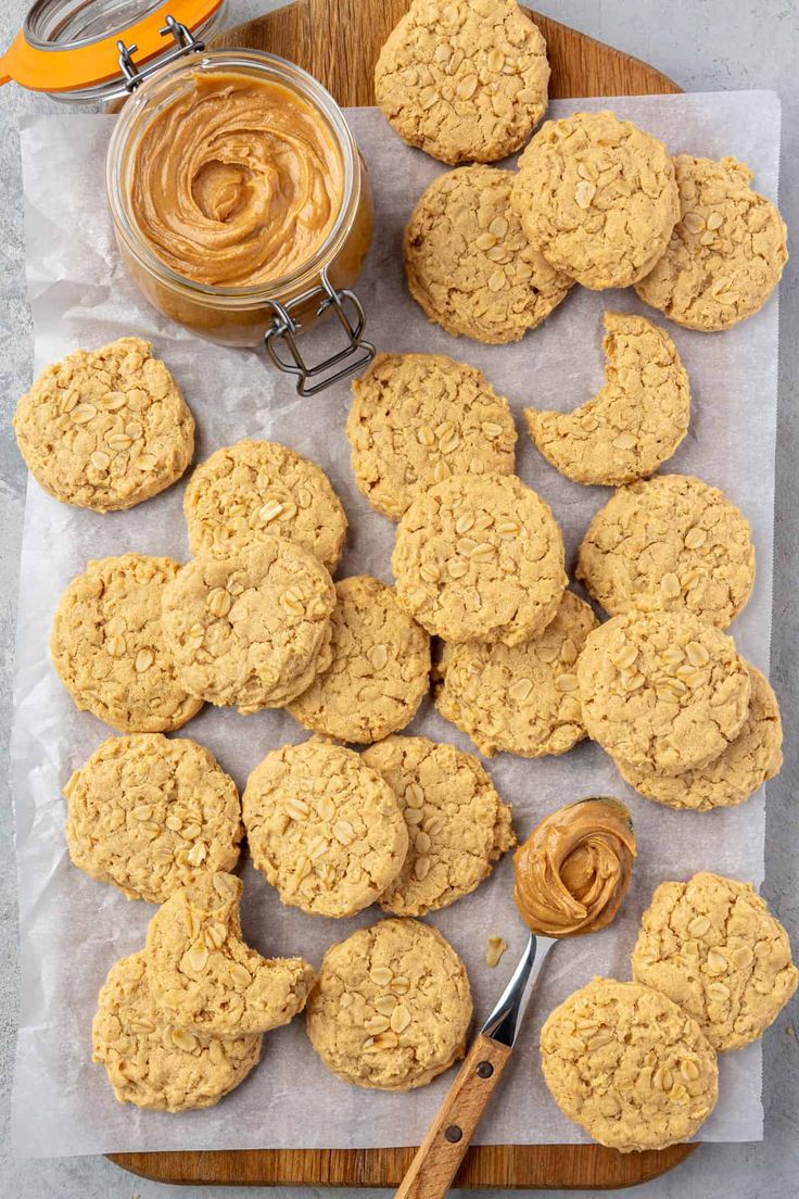 cookies and peanut butter on a cutting board