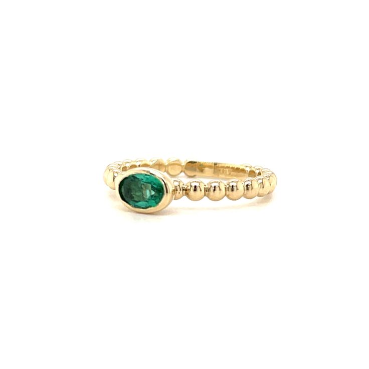 Our new beaded band ring is set with a beautiful oval 5x3 Emerald. The perfect sweet size to stack or wear every day. We set this stone in a sold gold bezel with an open bottom that allows the light to come in. There's a sizing bar at the bottom that allow us to make easy changes to the size without ruining the integrity of the beads. You'll love this new ring! 14K yellow gold 5x3 Oval Emerald Ring sizes 5-8 Beaded band design Classic Oval Stackable Rings With Bezel Setting, Elegant Oval Stackable Emerald Ring, Classic Oval Stackable Emerald Ring, Elegant Oval Emerald Stackable Ring, Oval Stackable Birthstone Ring In Fine Jewelry Style, Oval Birthstone Stackable Ring In Fine Jewelry Style, Yellow Gold Oval Stackable Rings, 14k Gold Stackable Rings With Smooth Bezel, Yellow Gold Oval Birthstone Ring Stackable