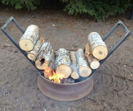 a fire pit with logs in it on facebook