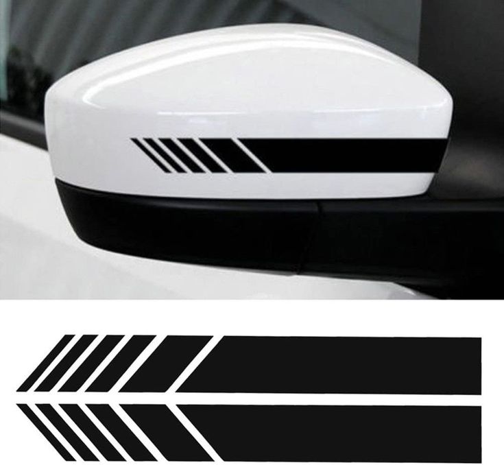 the side view mirror on a car with black and white arrows painted on it's sides