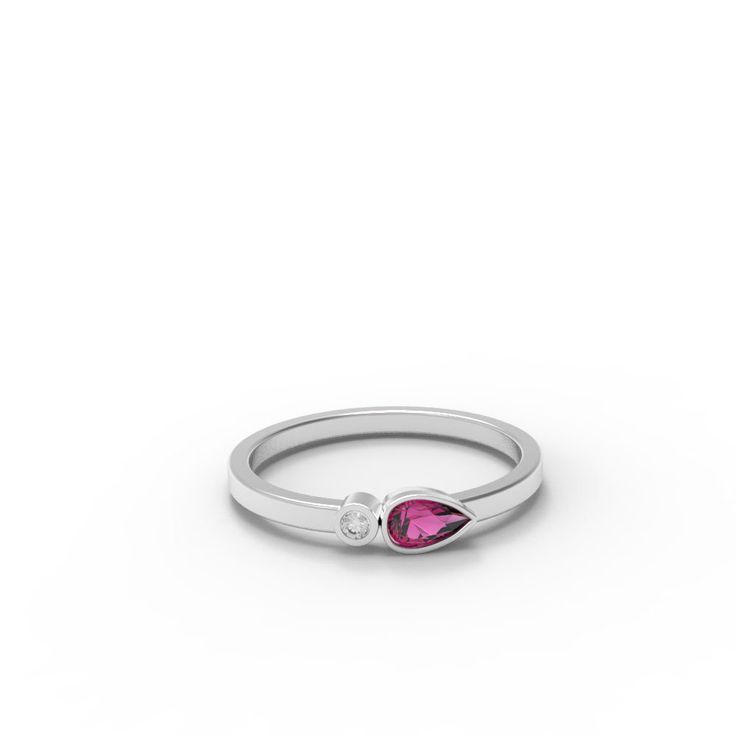 Dainty cluster ring set with a perfect Pink Ruby and a small diamond. Perfect for stacking or wearing solo. - Made to Order, perfectly finished, Fast shipping fully insured and trackable online. - Ruby info: 5x3 mm pear cut Ruby corundum, 0.25 ct - Diamond info: Single diamond, 1.75 mm VS-E, 0.023ct - Band width: 1.8 mm - Arrives gift ready with a certificate of authenticity. Ruby Promise Ring With Brilliant Cut Cubic Zirconia, Promise Cluster Ring With Birthstone In Fine Jewelry Style, Fine Jewelry Cluster Ring With Birthstone For Promise, Promise Cluster Ring With Birthstone, Dainty Sapphire Ring With Rose Cut Diamonds For Anniversary, Elegant Cluster Birthstone Promise Ring, Heirloom Sapphire Ring With Diamond, Fine Jewelry Diamond Birthstone Ring With Center Stone, Solitaire Ruby Promise Ring