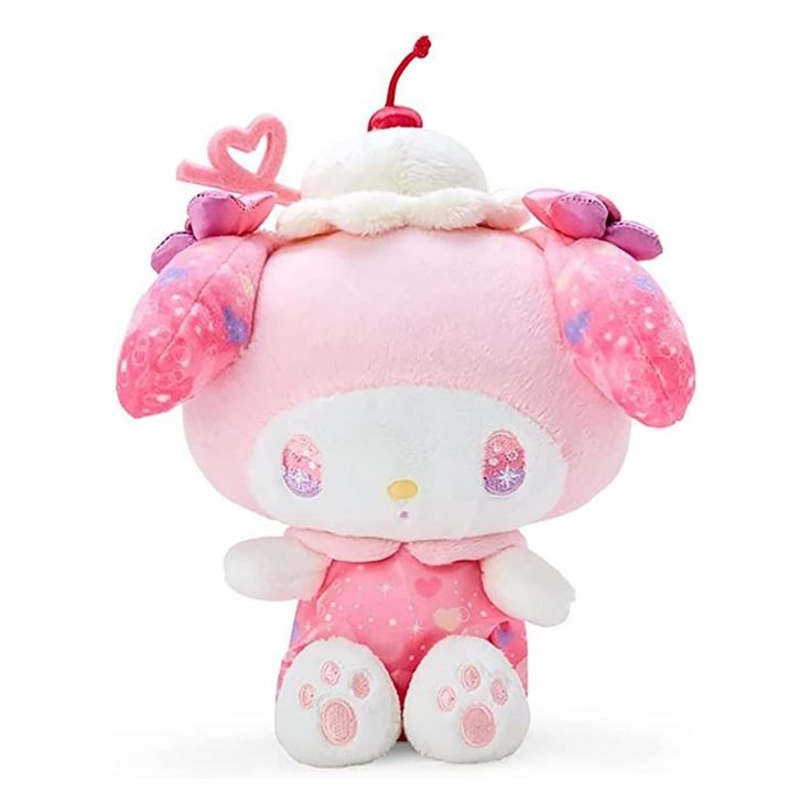 a pink hello kitty stuffed animal with hearts on it's head and ears, sitting in front of a white background