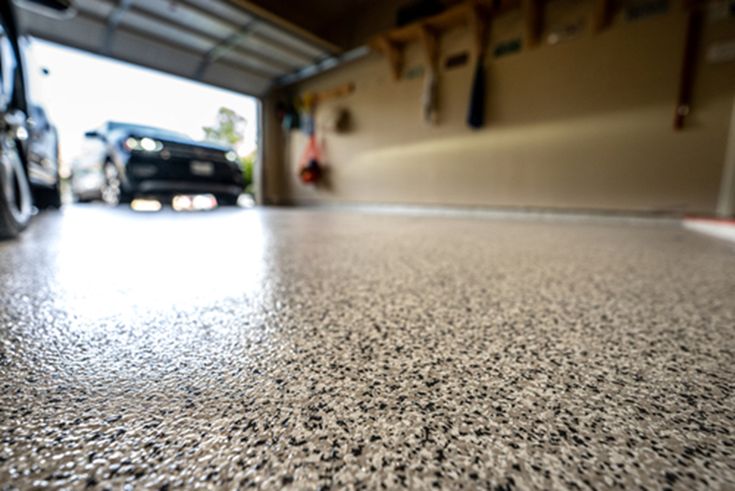 a car parked in front of a garage door