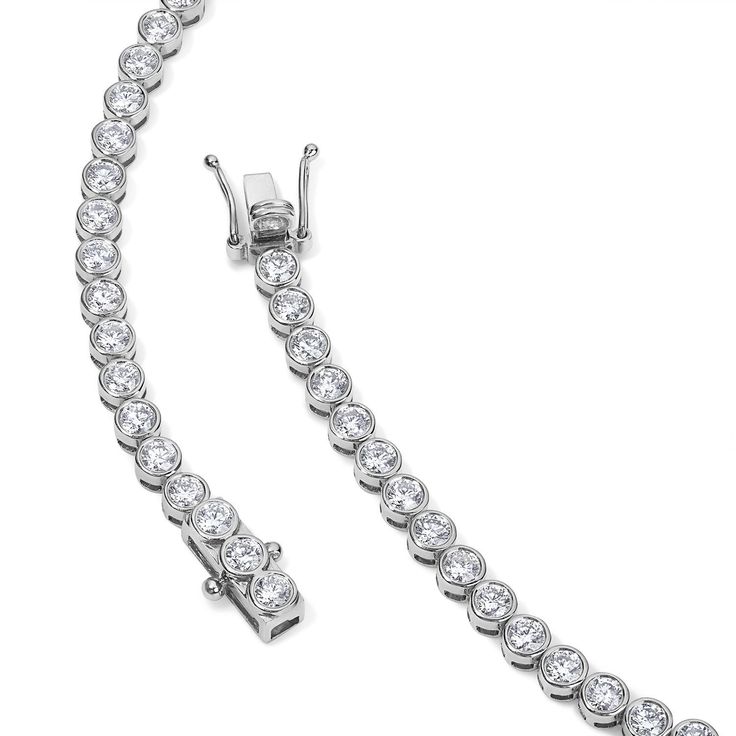 The bezel set round diamond necklace is the perfect statement piece and make a great addition to any outfit! Available in 14K Yellow Gold and White Gold Diamond quality = GH-Color, SI-Clarity Necklace length options: 15in = 8.80 carats 16in = 9.28 carats Round Diamond Necklace With Channel Set, Channel Set Round Diamond Necklace, Round Bezel Set Tennis Necklace For Anniversary, Dazzling Necklace With Bezel Setting And Round Cut, Classic Bezel Set Round Diamond Necklace, Dazzling Round Cut Necklace With Bezel Setting, Channel Set Diamond Round Necklace, Classic Bezel Set Tennis Necklace For Anniversary, Classic Tennis Necklace With Bezel Setting For Anniversary