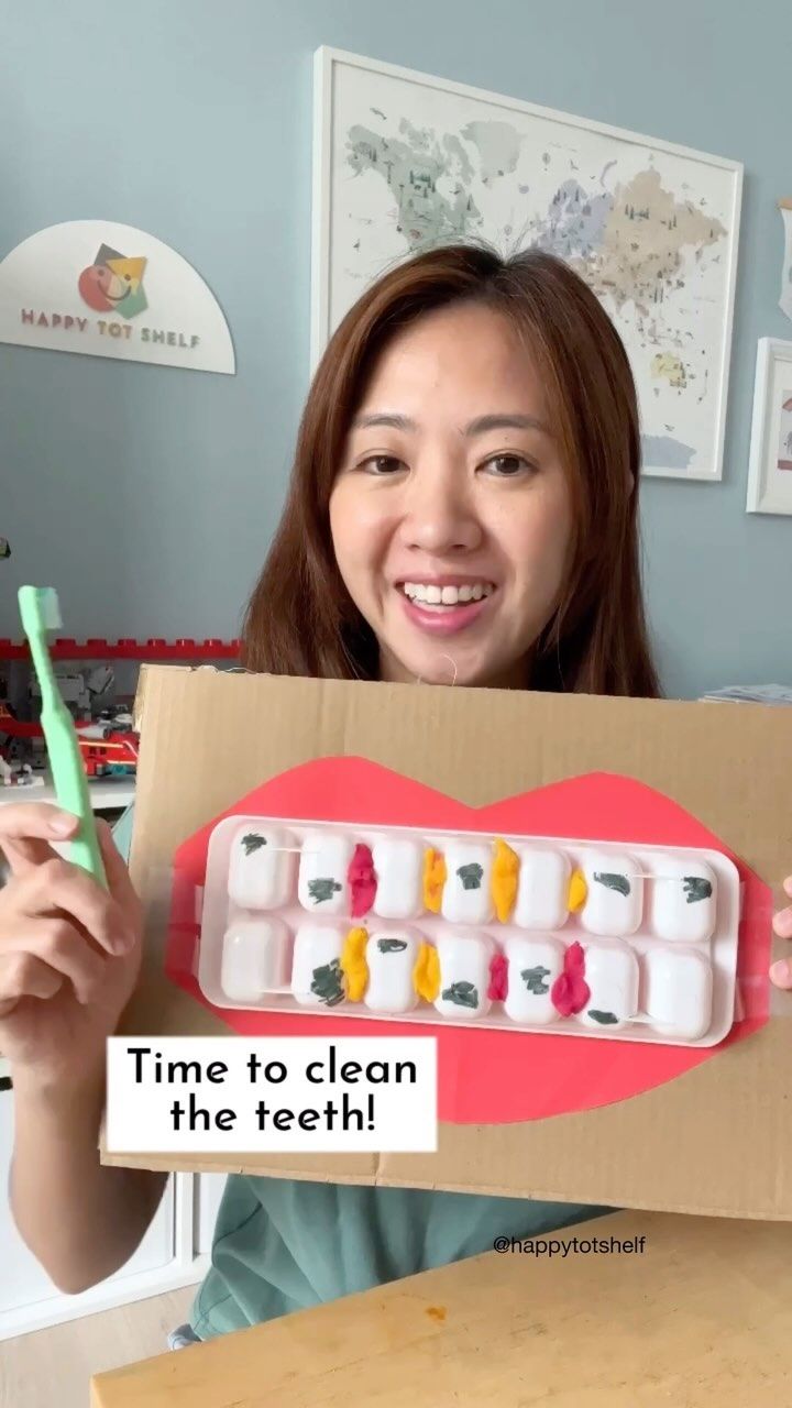 a woman holding up a box with toothpaste in it that says time to clean the teeth