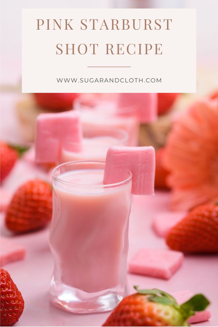 pink starburst shot recipe with strawberries and marshmallows on the side