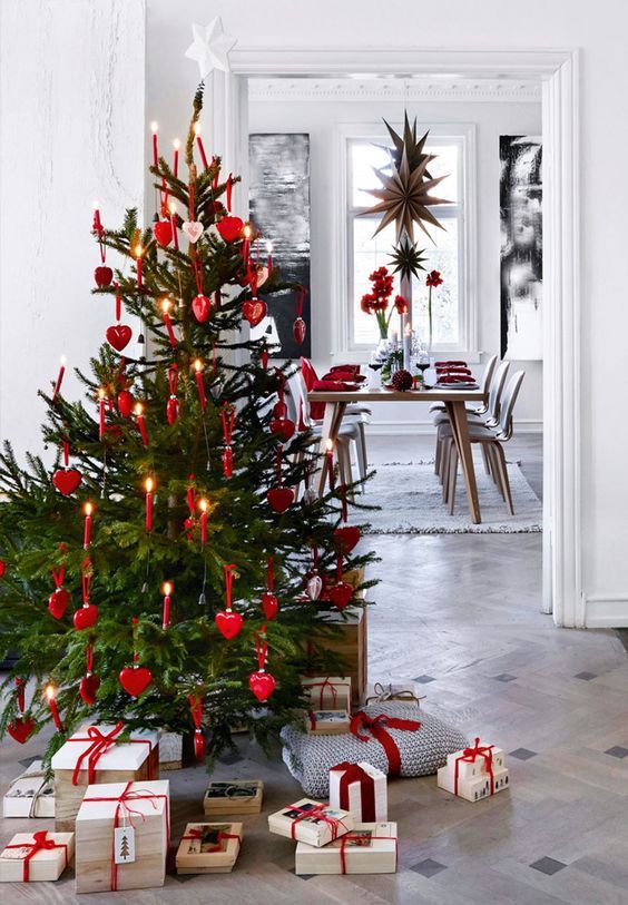 a decorated christmas tree with presents under it