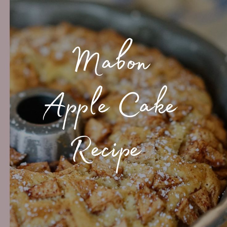 a close up of a cake in a pan with the words mabon apple cake recipe