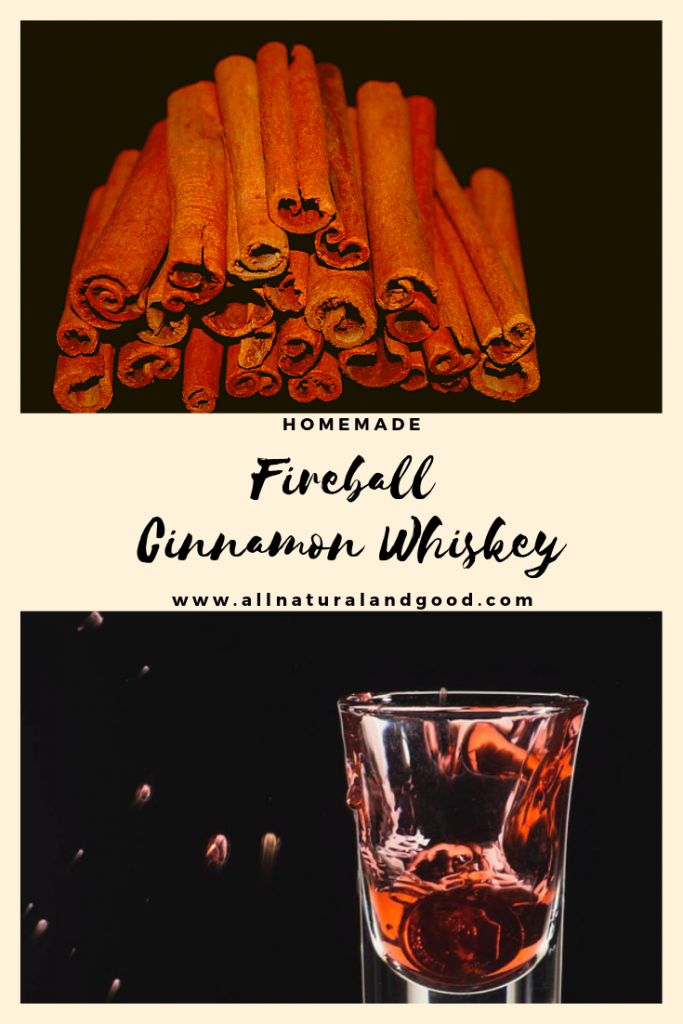 some cinnamons are sitting next to a glass with liquid in it and the words homemade fireball cinnamon whiskey