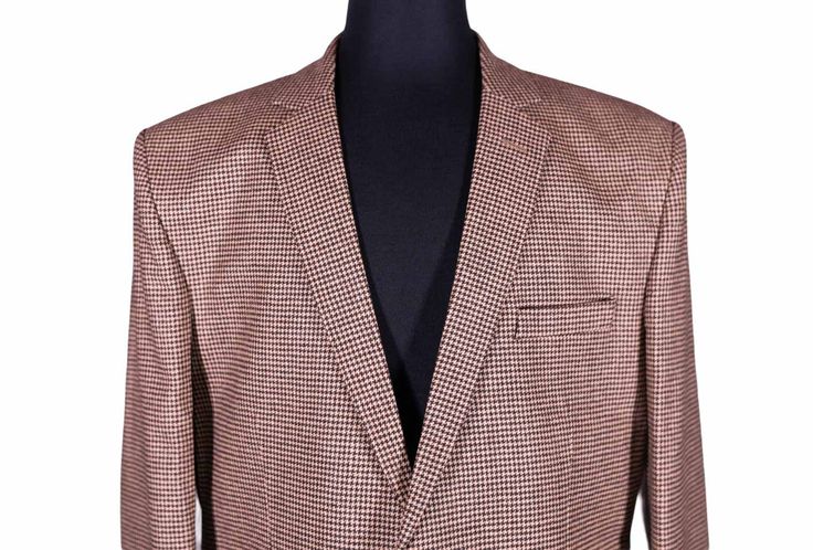 This Chiragh Apparel blazer is an elegant upgrade on dapper tailoring and features rich shades in a sumptuous fabric for elegant opulence. Fashioned from 100% premium quality wool, this houndstooth check blazer features full lining in Japanese silk, a notch lapel, two-button closure and single vented back. A left chest pocket and three flap pockets appoint the front while the inside has two (2) pockets on the left and one (1) pocket on the right. A flash of contrast piping is added to the jacket Elegant Fitted Tweed Jacket With Houndstooth Pattern, Elegant Fitted Houndstooth Tweed Jacket, Tailored Houndstooth Tweed Jacket For Business, Business Tweed Jacket With Houndstooth Pattern And Suit Collar, Tailored Houndstooth Blazer For Formal Occasions, Elegant Tailored Houndstooth Sport Coat, Semi-formal Tweed Jacket With Houndstooth Pattern And Suit Collar, Semi-formal Houndstooth Tweed Jacket With Suit Collar, Semi-formal Tweed Jacket With Houndstooth Pattern