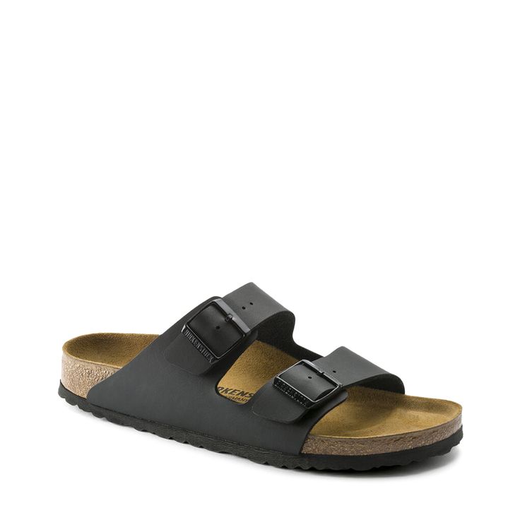 Walk down the street in comfort wearing these men's Birkenstock black Arizona slides. They feature a Birko-Flor upper (a synthetic, long wearing, skin friendly material) with an open toe slip-on design, two individually adjustable straps with buckle closures for a customized fit, an anatomically shaped cork-latex footbed, a suede lining, and an EVA outsole. | Birkenstock Men's Arizona Sandal in Black Size EU 46/US 13-13. 5 Medium Birkenstock Colors, Arizona Style, Men Birkenstock, Black Birkenstock, Birkenstock Men, Birkenstock Black, Simple Sandals, Mens Shoes Sandals, Camouflage Green