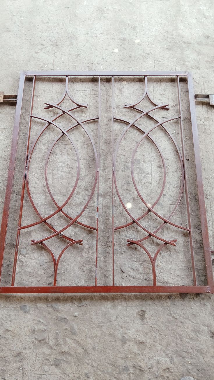 an iron window on the side of a building