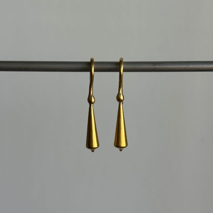 Stately everyday earrings that unite form with fluidity. 22k yellow gold Tapered pod is 5mm x 18mm (3/16" x 3/4")Earrings hang 1 3/16" from the earEach earring weighs 2.4g Contemporary Teardrop Yellow Gold Earrings, Contemporary Yellow Gold Teardrop Earrings, Hand Forged Long Drop Modern Earrings, Contemporary Everyday Drop Earrings, Modern Formal Earrings In Recycled Gold, Modern Recycled Gold Earrings For Formal Occasions, Minimalist Teardrop Earrings In Recycled Gold, Modern Recycled Gold Earrings For Formal Events, Gold Minimalist Drop Earrings