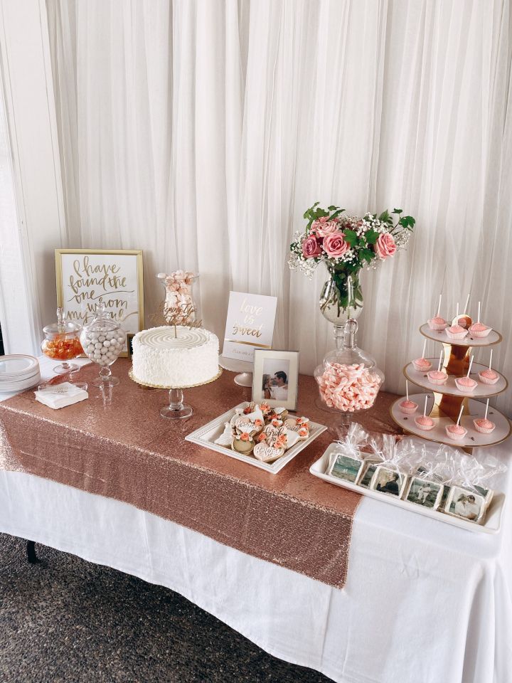 a table topped with lots of cakes and desserts