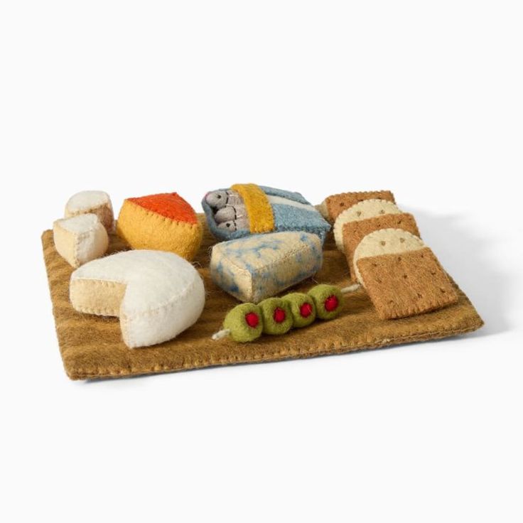 an assortment of breads and pastries on a tray