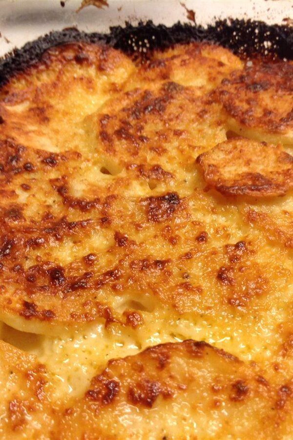 a cheesy dish is shown in a pan