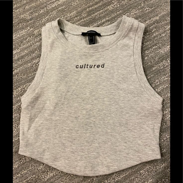 The Cutest Crop Top From Forever 21, Grey. Nwot, Never Worn. Fitted Sleeveless Top With Text Print, Fitted Crew Neck Tank Top With Text Print, Spring Fitted Tank Top With Text Print, Fitted Text Print Tank Top For Summer, Fitted Tank Top With Text Print For Spring, Fitted Summer Tank Top With Text Print, Forever 21 Cotton Crop Top Tank Top, Forever 21 Fitted Trendy Tank Top, Forever 21 Trendy Stretch Tank Top