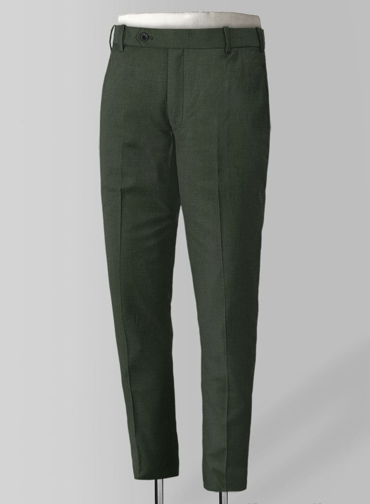 If you think a tailored, bespoke pants fetch a pretty penny, well than our Scabal Seaweed Green Wool pants are worth the value as it reflects sophistication and class. Crafted from wool, an ideal piece for gentlemen of stature who requires diplomatic style for smooth boardroom negotiations. Team it up with a matching jacket and waistcoat, a white shirt, patterned beige tie and dark brown derby shoes. 
 
 Look Includes  Scabal Seaweed Green Wool Fabric  Cross Pocket  Flat Front  Two Welted Back P Emerald Green Pants, Dark Green Suit, Dark Green Tie, Modest Luxury, Hunter Green Pants, Green Suit Men, Dark Green Pants, Fabric Cross, Timeless Glamour