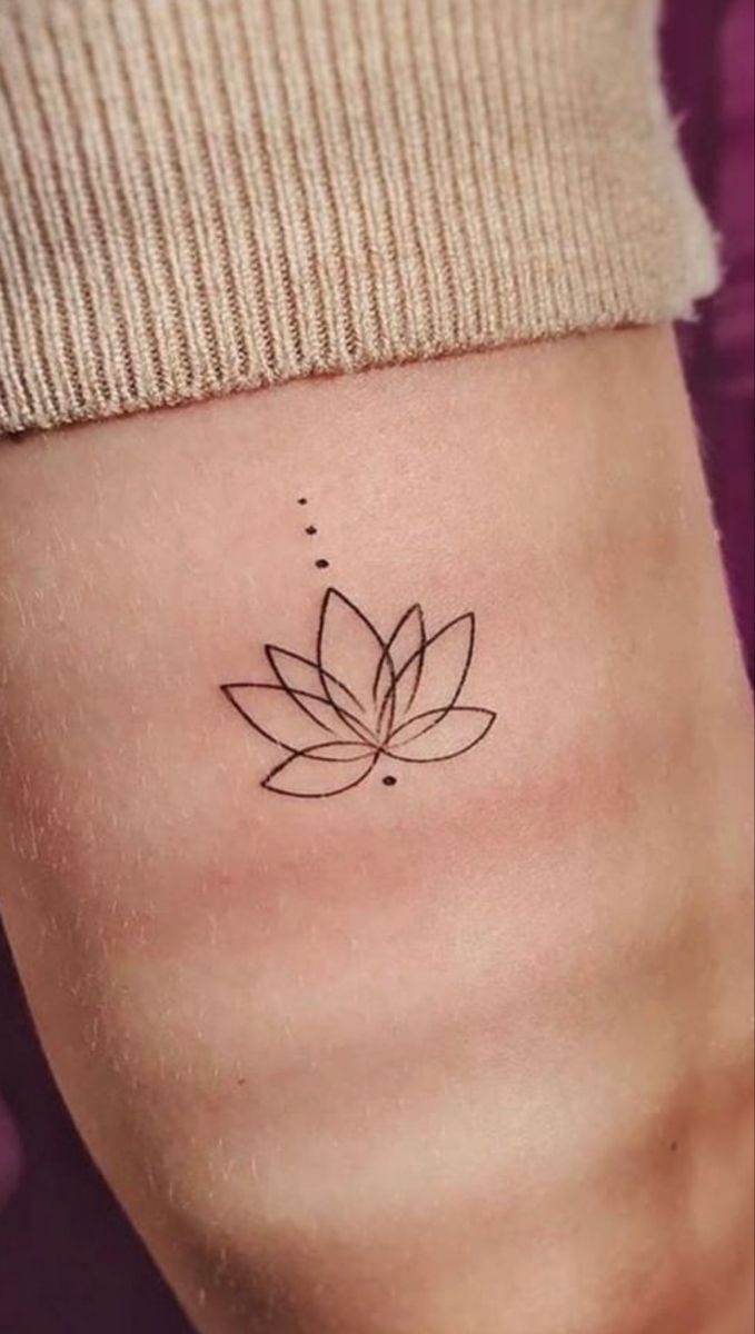 a lotus flower tattoo on the ankle