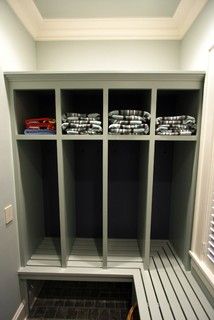 an empty walk in closet with several shelves