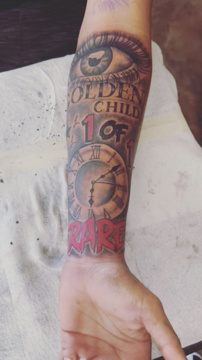 a person with a clock tattoo on their arm