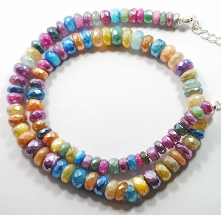 Genuine Multi Coated Moonstone Gemstone beads Faceted Roundel Shape Necklace 5.5-8.5 MM Approx 1 strand 16 Inch  AAA Quality Necklace Quality = AAA Strand length: approximately 16 Inch Stone Size:  5.5-8.5 MM Approx Stone Shape: Roundel Style =  Faceted Colors = Multi Colors Moonstone Necklace Lock = Silver Lock Hole size: approximately 0.60 mm Bulk wholesale pricing is available convo me for information on this listing or any others in my shop. We are continuously adding new products in our store. So keep coming back to see more great deals. CLICK BELOW TO CHECK ALL OUR BEAUTIFUL RONDELLES https://www.etsy.com/in-en/shop/JaipurGemsBeadsCo?ref=search_shop_redirect Have questions? Please contact us via messaging option. We will resolve your query within maximum 24 hours. Private Assistance Disco Necklace, Necklace Lock, Gemstone Beads Wholesale, 16 Inch Necklace, Imperial Topaz, Necklace Beads, Moonstone Necklace, Blue Crystals, Gemstone Necklace