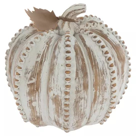 a decorative white pumpkin with brown leaves on it's top and bottom, sitting in front of a white background