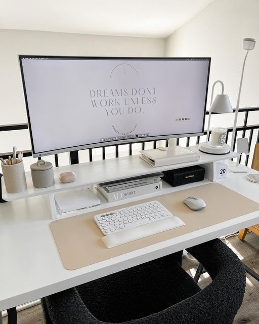 a computer desk with a monitor, keyboard and mouse sitting on it's side