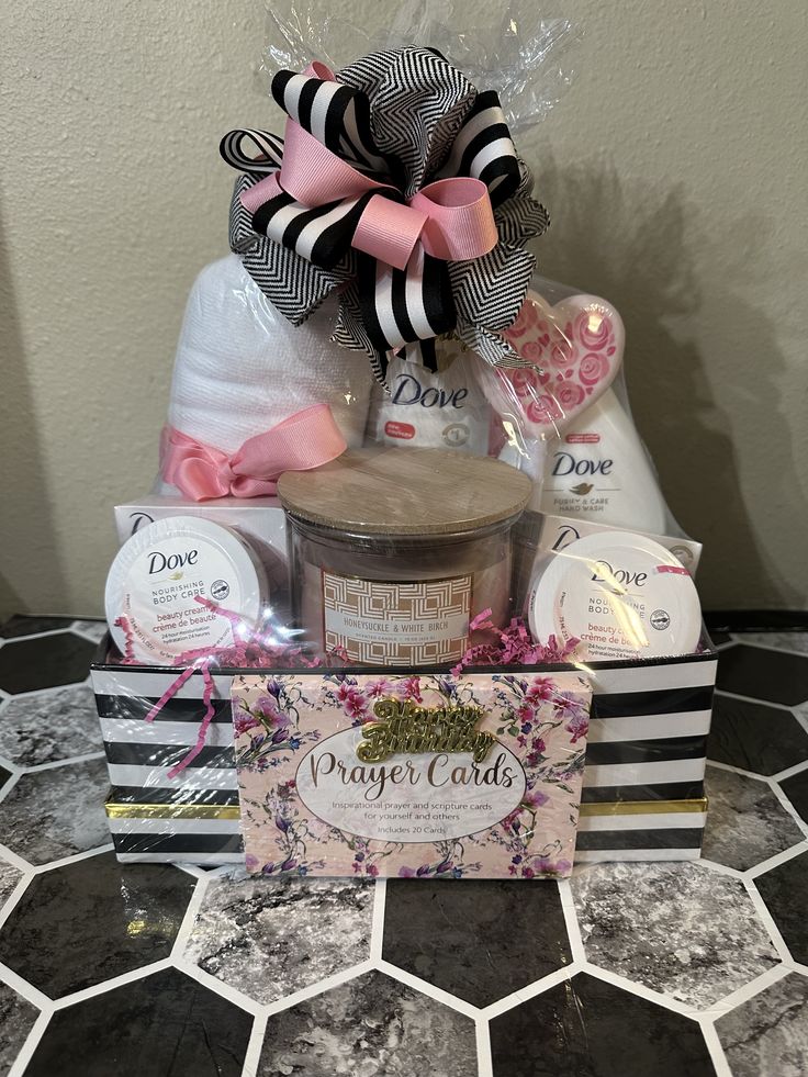 a gift basket filled with soaps, candles and other items