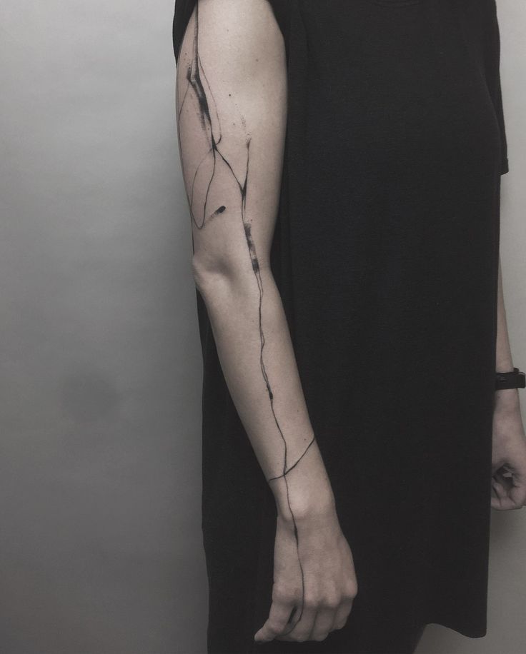 a woman with a tattoo on her arm