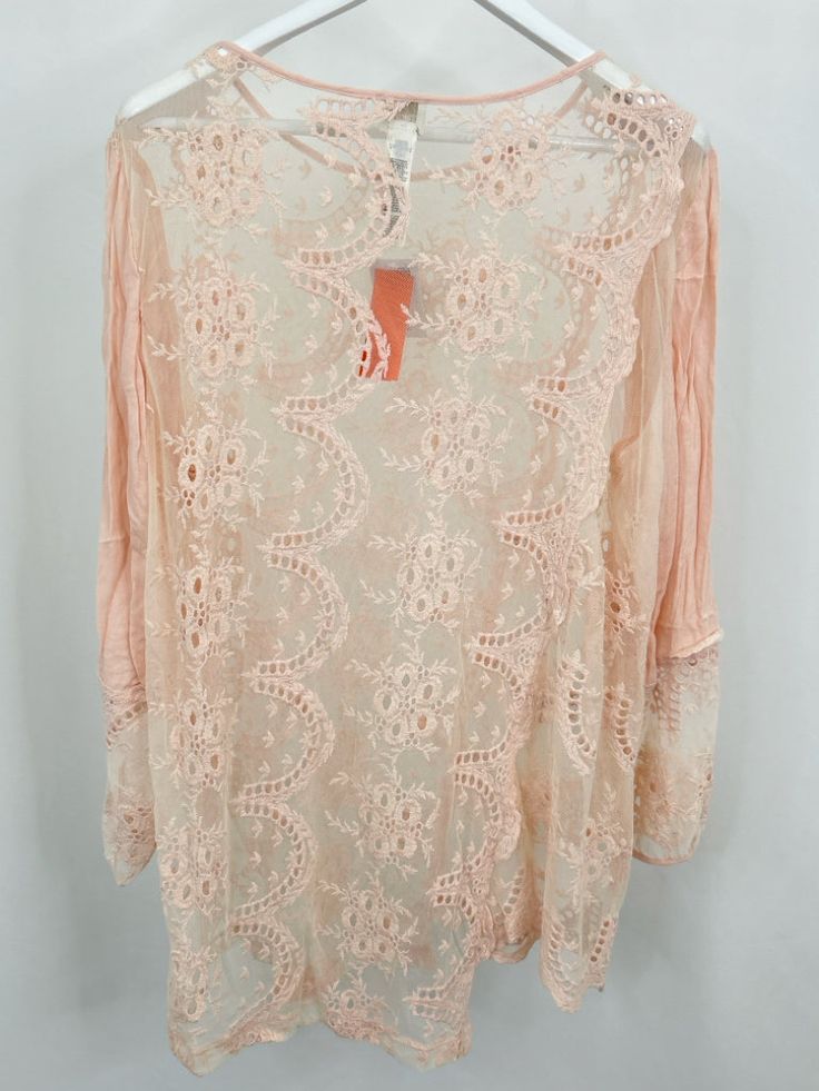 NWT $99. Chico's size 4. Novelty Lace Tunic in Pale Dogwood. Scoop neckline. Sheer lace bodice. 3/4 sleeves. Asymmetrical front hem. Cotton blend. Machine wash. Brand = CHICO'S Women Size = 20 Color = light pink Item Number: 4535-103 Item ID: 371996 Category: Tunic Beige Lace Patchwork Top For Spring, Cream Lace Top With Patchwork For Spring, Spring Pink Tops With Lace Sleeves, Pink Lace Sleeve Top For Spring, Sheer Long Sleeve Lace Top For Summer, Pink Summer Blouse With Lace Sleeves, Summer Lace Blouse With 3/4 Sleeves, Cream Lace Top For Spring, Spring Cream Lace Top