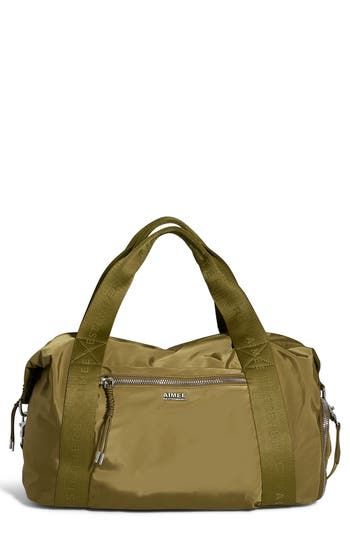 This lightweight duffle with webbed top handles and an optional shoulder strap is the perfect carryall for travel or the gym. A trio of exterior zip pockets keeps essentials organized, while a wide strap ensures it slips over your luggage with ease. Two-way top zip closure Top carry handles; adjustable removable shoulder strap Exterior zip pockets; slip pocket with magnetic snap closure Interior zip and slip pockets Slip-through luggage strap Water-resistant Lined Recycled polyester/polyester Im Versatile Nylon Satchel For Travel, Functional Tote Duffle Bag With Detachable Strap, Functional Duffle Bag With Detachable Strap, Functional Satchel Weekender Bag With Detachable Strap, Functional Weekender Satchel Bag With Detachable Strap, Functional Weekender Bag Satchel With Detachable Strap, Functional Weekender Bag With Detachable Strap And Satchel Shape, Casual Duffle Bag With Zipper And Double Handle, Functional Duffle Bag With Detachable Strap And Double Handle