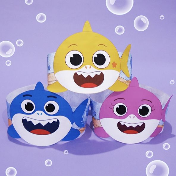 three little sharks are standing next to each other in front of bubbles on a purple background