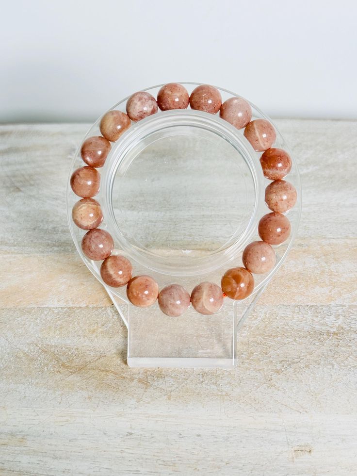 PLEASE NOTE: Sometimes Etsy calculates shipping incorrectly, but please be assured I will refund any extra shipping charges.  Available in: 7mm or 8mm Peach Moonstone is a soothing and nurturing stone that enhances emotional healing and promotes inner peace. It is known for its ability to calm the mind, alleviate stress, and encourage a sense of emotional balance. This stone supports self-love, compassion, and the gentle release of suppressed emotions, making it ideal for those seeking comfort and reassurance. Peach Moonstone also enhances intuition and creativity, helping to guide you on your spiritual and personal journey. NOTE: please note natural crystals may have small imperfections. I try to show all details in my photos and videos, but some random imperfections cannot be helped. Our Rose Quartz Round Bracelets For Meditation, Rose Quartz Crystal Bracelet For Meditation, Rose Quartz Round Crystal Bracelet For Meditation, Round Rose Quartz Crystal Bracelet For Relaxation, Minimalist Crystal Bracelet With Round Beads For Healing, Minimalist Round Beads Crystal Bracelet For Healing, Round Hypoallergenic Crystal Bracelet For Healing, Hypoallergenic Round Crystal Bracelet For Healing, Spiritual Round Rose Quartz Stretch Bracelet