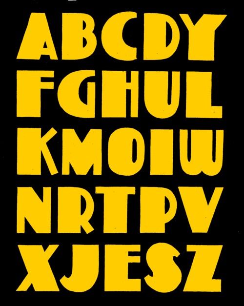 the alphabet is yellow and black with white letters